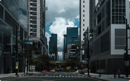 Urban cityscape with skyscrapers and bustling traffic on a busy street, image