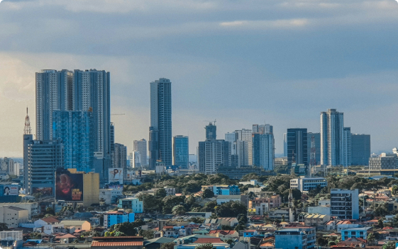 An urban landscape showcasing tall buildings against a backdrop of a serene blue sky, image