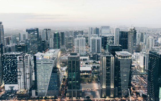 A bustling city skyline with towering buildings and heavy traffic flowing through the streets, image